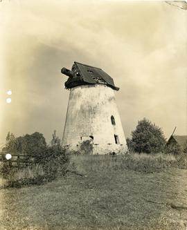 A picturesque view of a historic windmill, possibly Eastham Mill, in the Liverpool area.