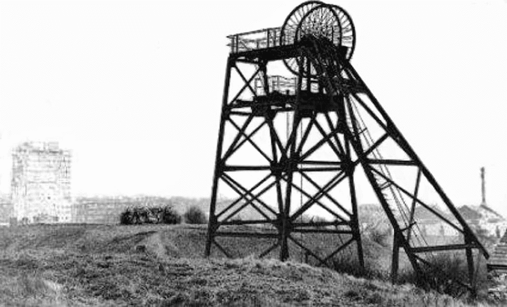 A photograph of miners from the Neston Colliery, circa early 20th century.
